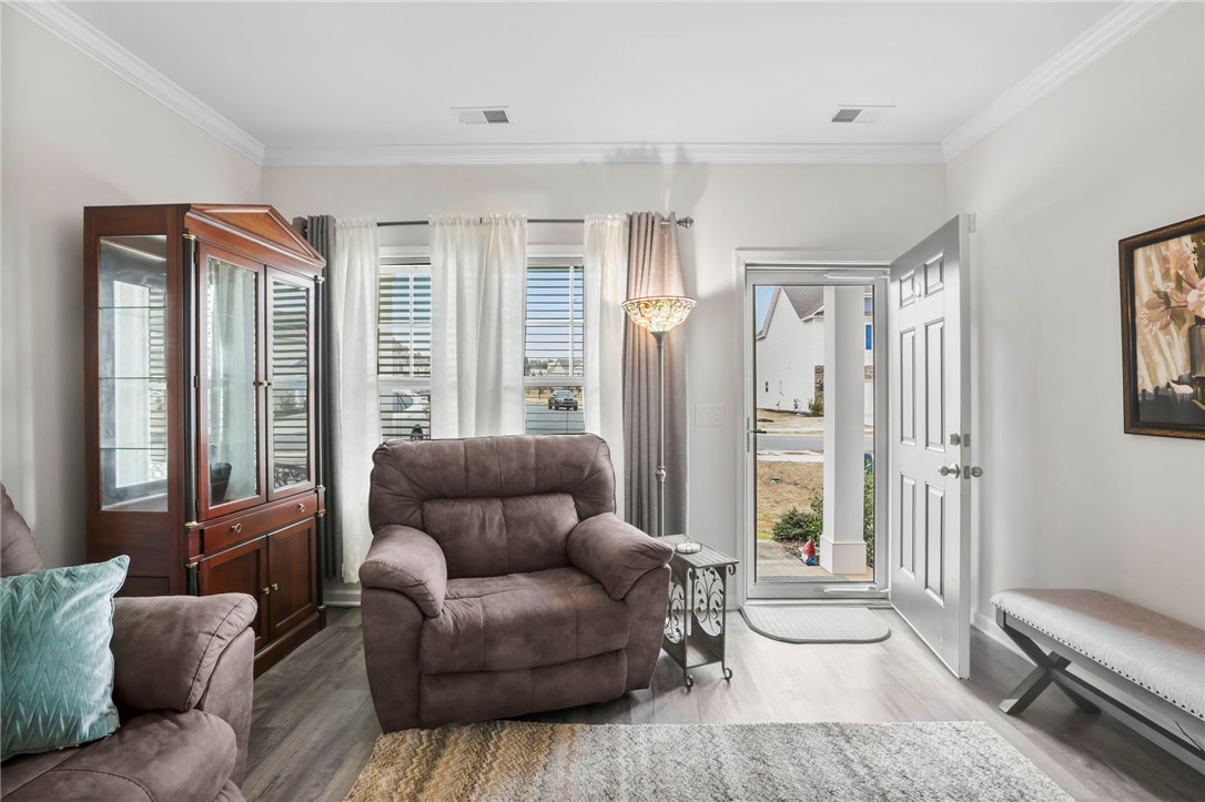 251 Samuel Street Pendleton, SC 29670 - Photo 4 of 37 This inviting living space features bright interiors and durable flooring.