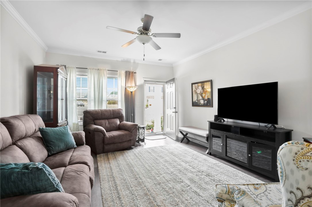 251 Samuel Street Pendleton, SC 29670 - Photo 6 of 37 This bright living room offers an inviting space for relaxation and gatherings.