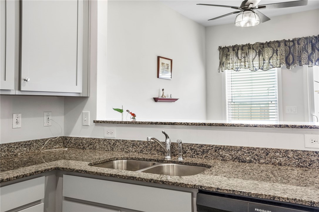 251 Samuel Street Pendleton, SC 29670 - Photo 10 of 37 This modern kitchen features durable countertops and sleek cabinetry, perfect for culinary endeavors.