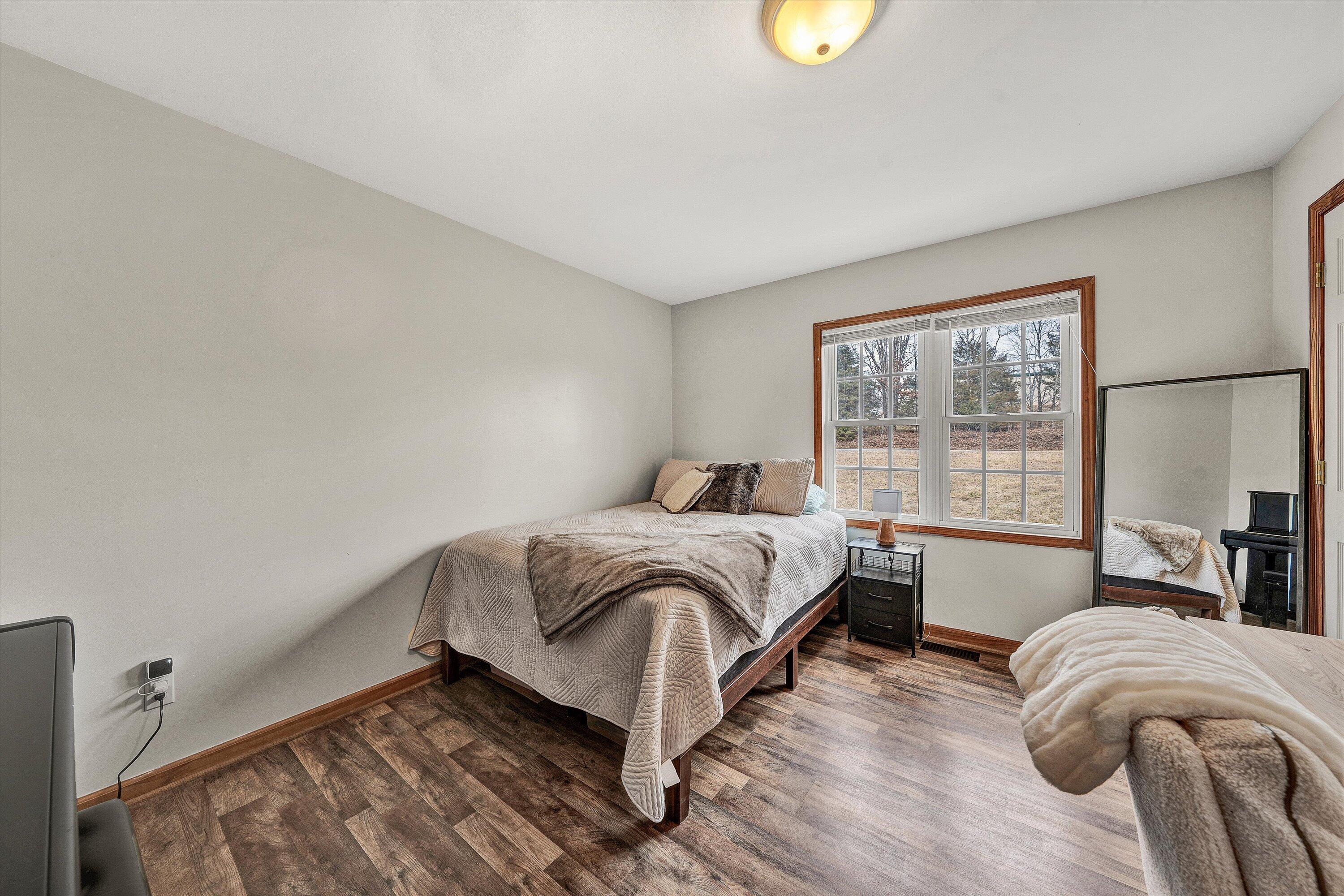 1188 Airport Road Moneta, VA 24121 - Photo 18 of 34 a bedroom with a bed and window