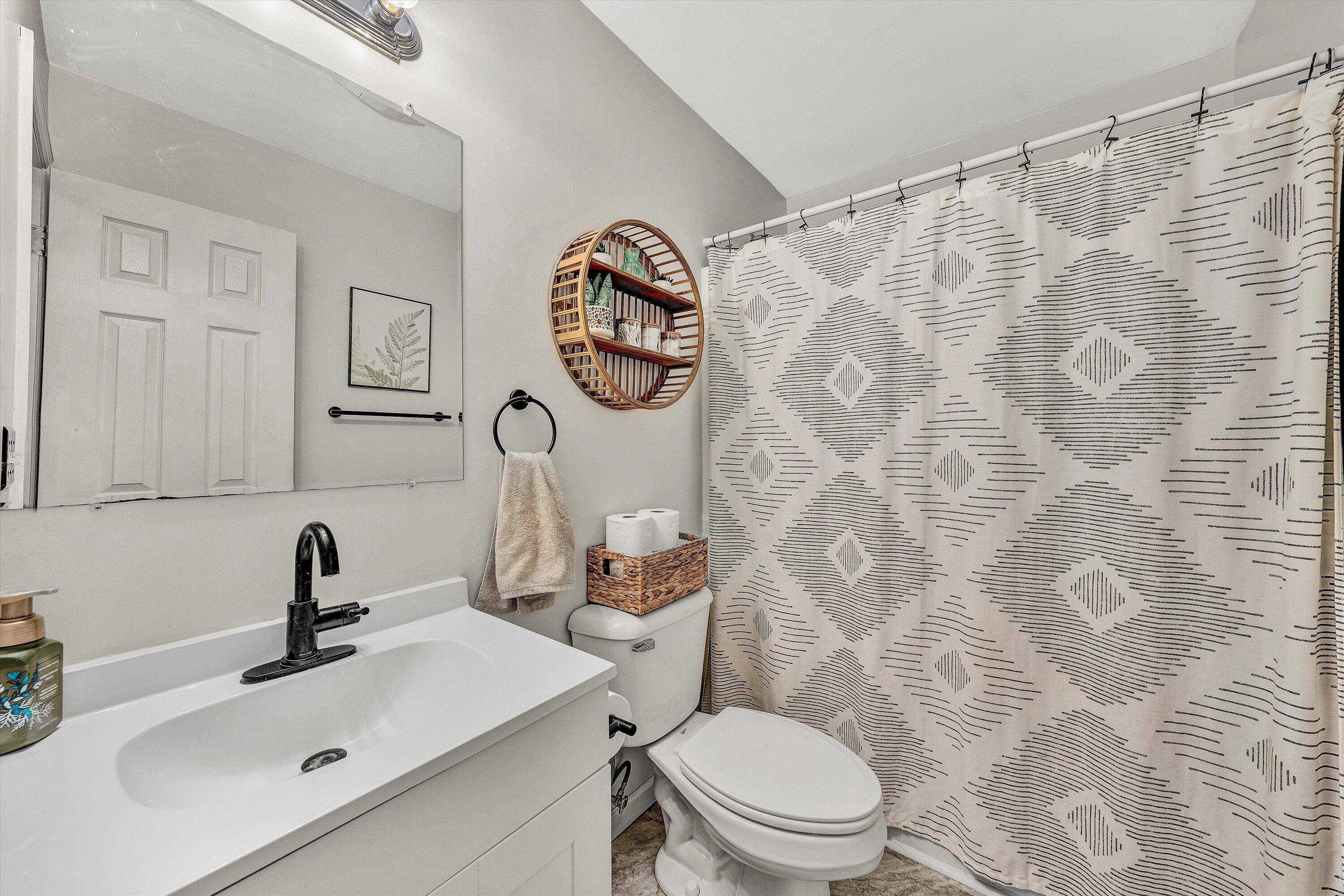 1188 Airport Road Moneta, VA 24121 - Photo 19 of 34 a bathroom with a sink mirror and toilet