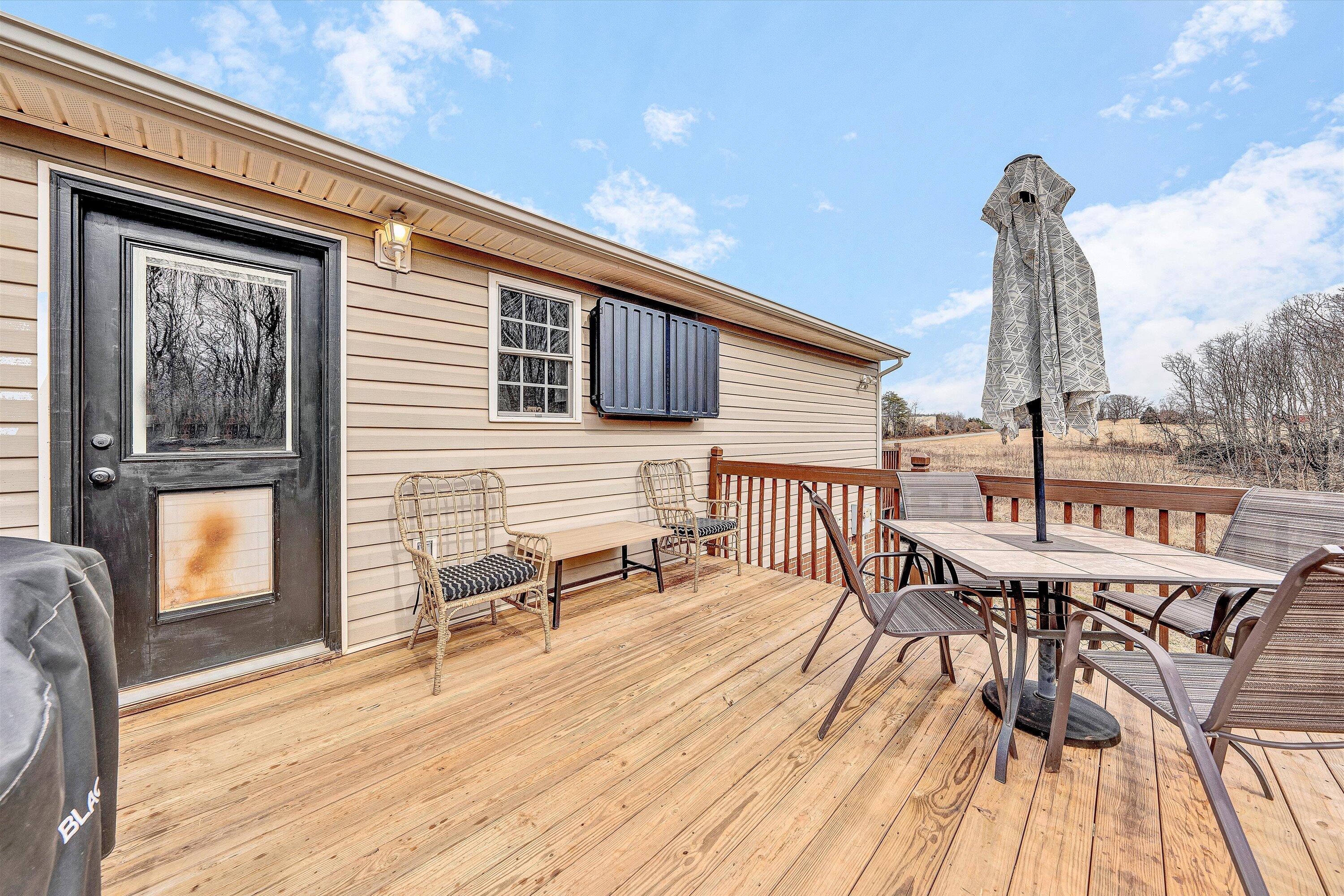 1188 Airport Road Moneta, VA 24121 - Photo 27 of 34 a balcony with furniture and wooden floor
