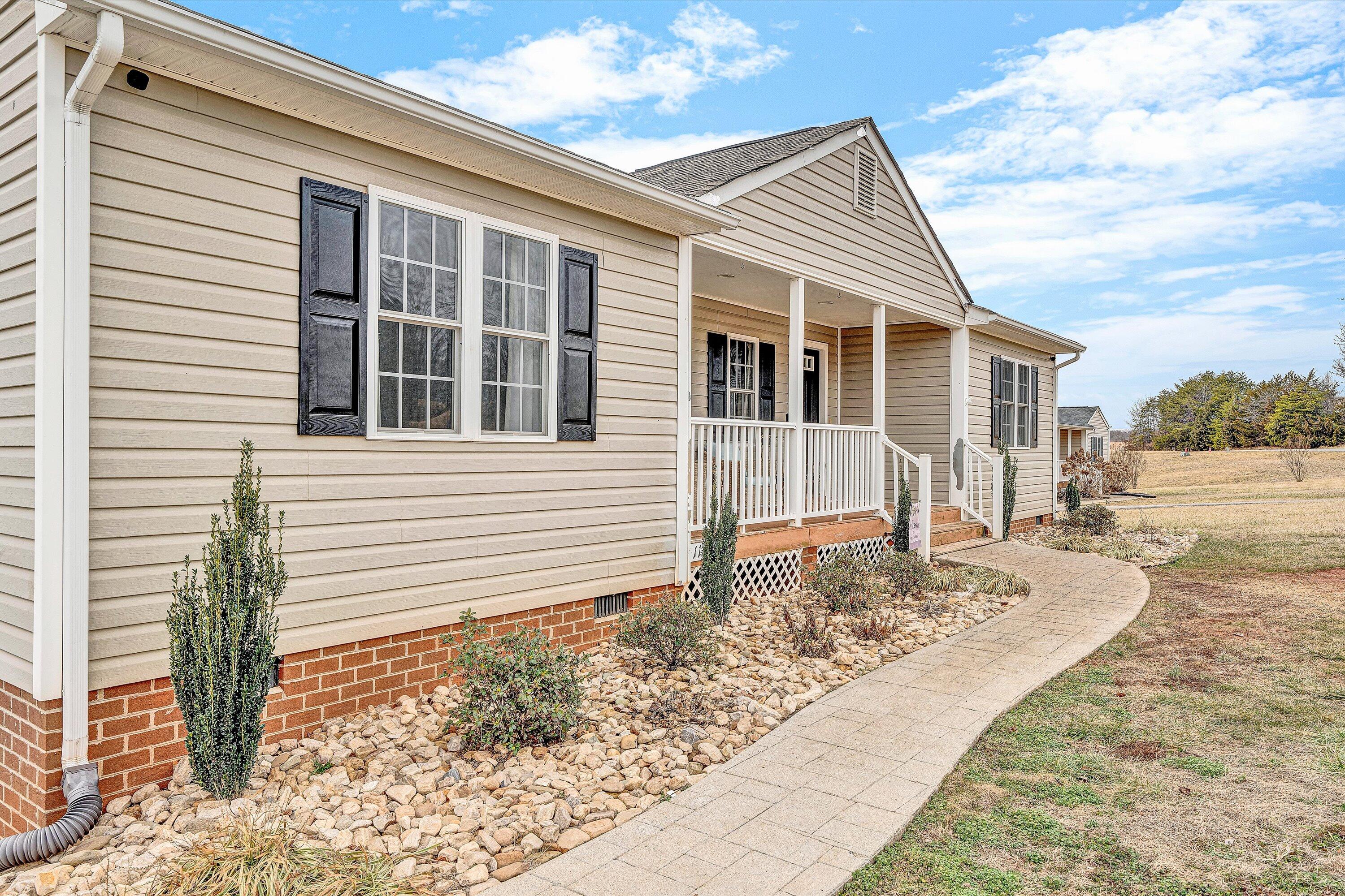 1188 Airport Road Moneta, VA 24121 - Photo 6 of 34 a front view of a house with a yard