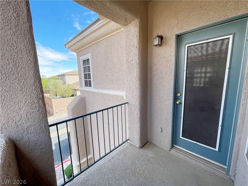 691 Principle Point Avenue Henderson, NV 89012 - Photo 22 of 30 A private balcony offers outdoor sanctuary with sweeping neighborhood views.