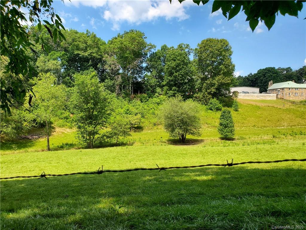 0 Trantham Road Canton, NC 28716 - Photo 1 of 10 a view of a golf course with a lake view
