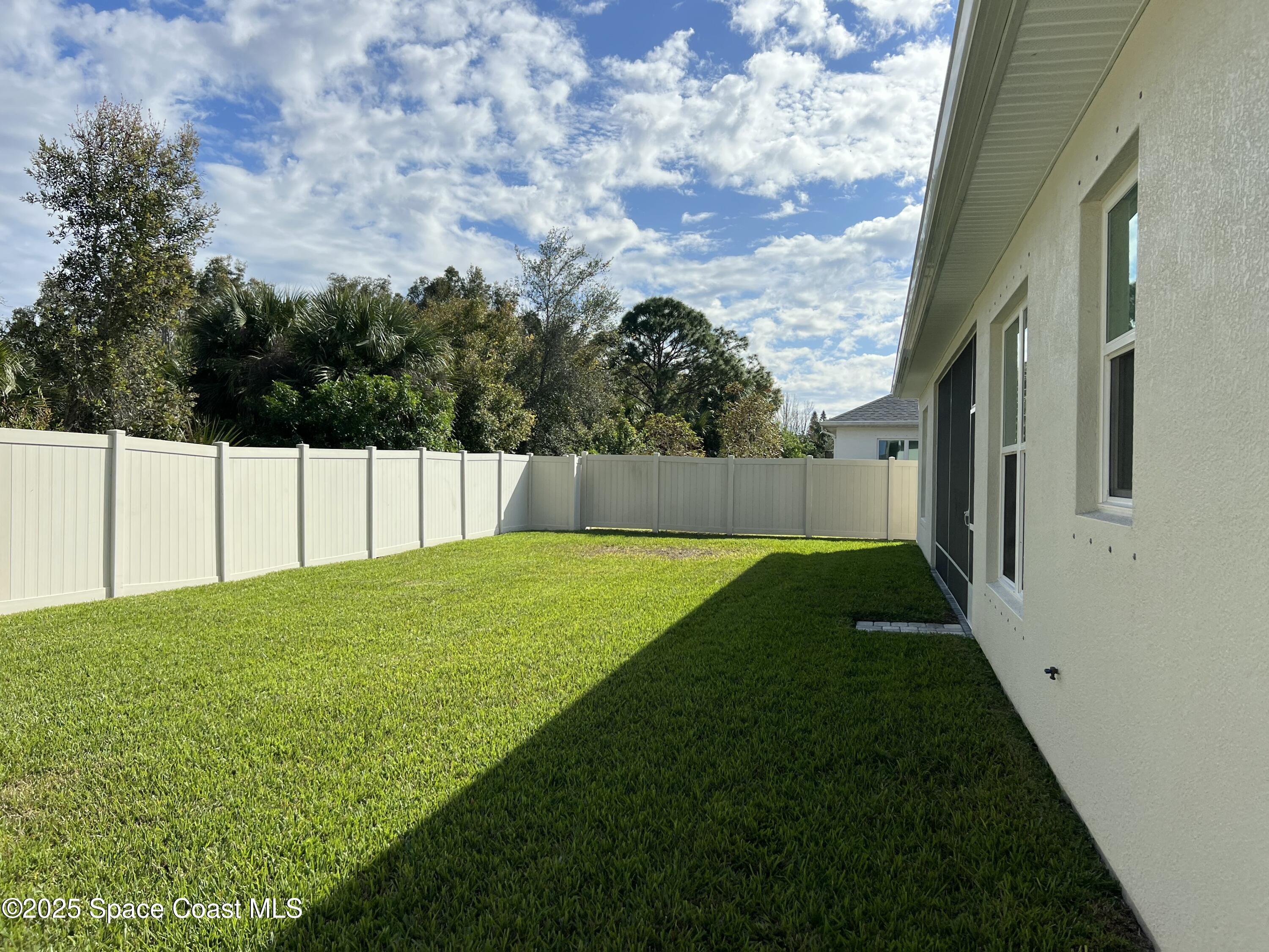 4305 Negal Circle Melbourne, FL 32901 - Photo 15 of 40 a view of yard with green space