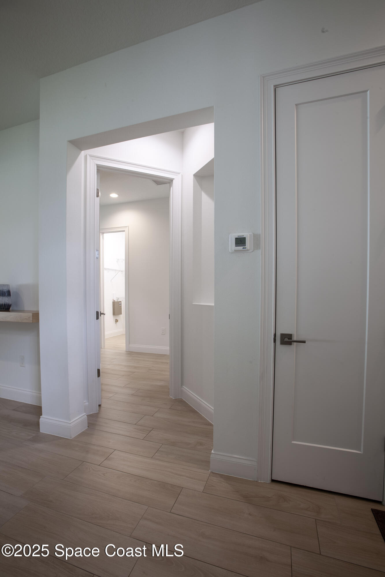 4305 Negal Circle Melbourne, FL 32901 - Photo 18 of 40 a view of a hallway with wooden floor