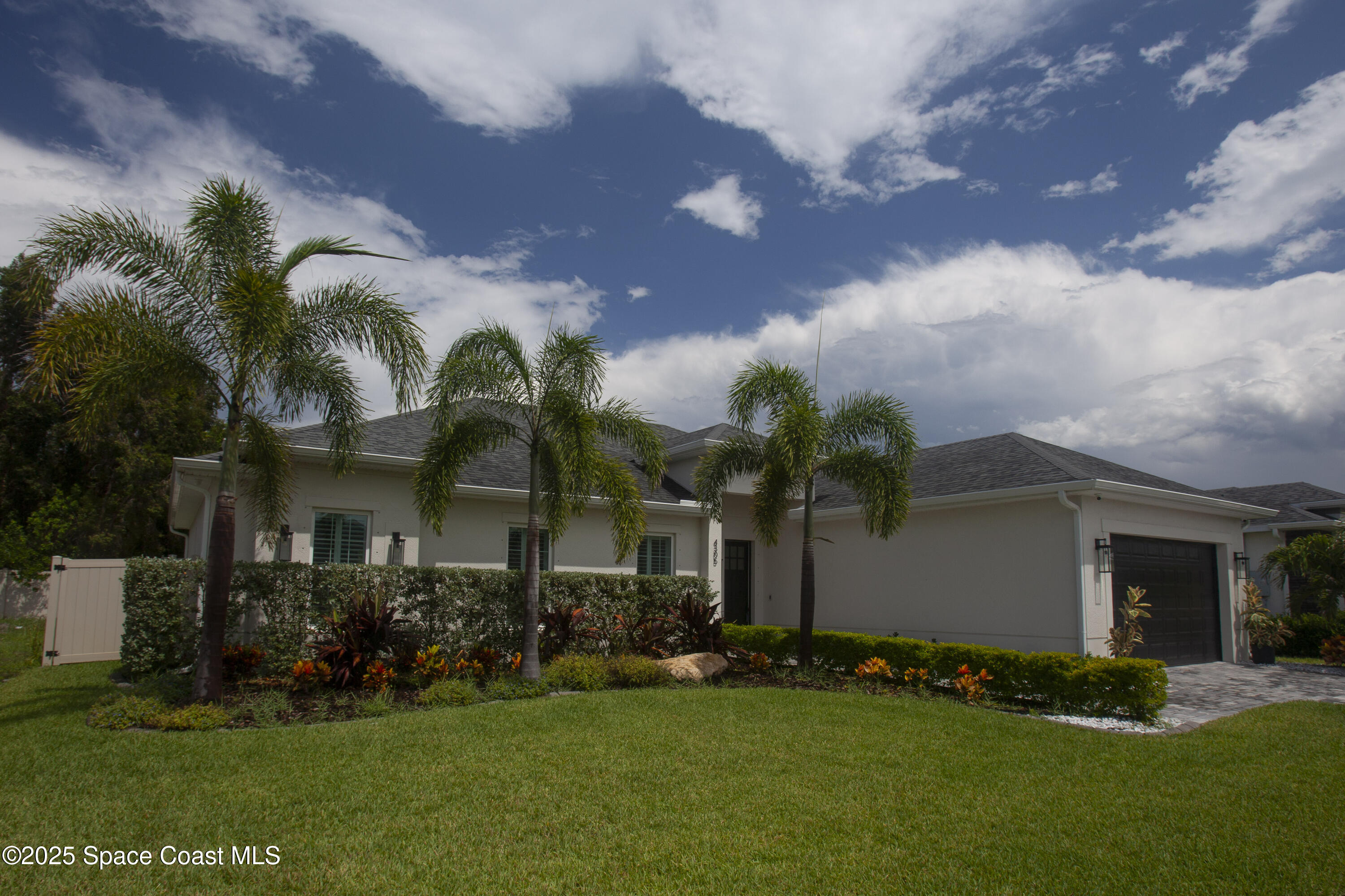 4305 Negal Circle Melbourne, FL 32901 - Photo 3 of 40 a view of a house with a yard