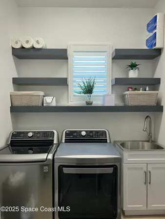 a view of a garage with rack and bicycle