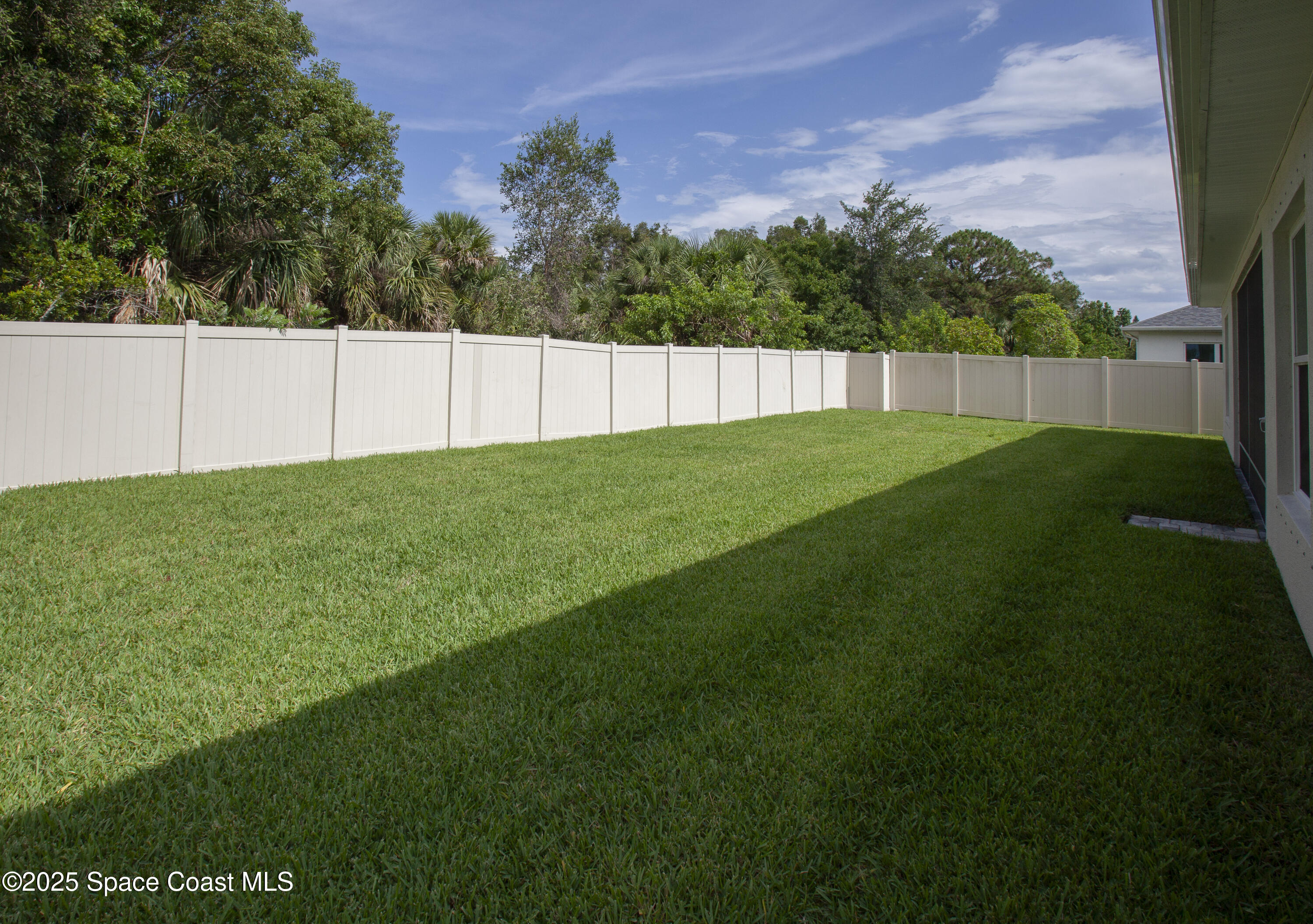 4305 Negal Circle Melbourne, FL 32901 - Photo 38 of 40 a view of a backyard with a small cabin