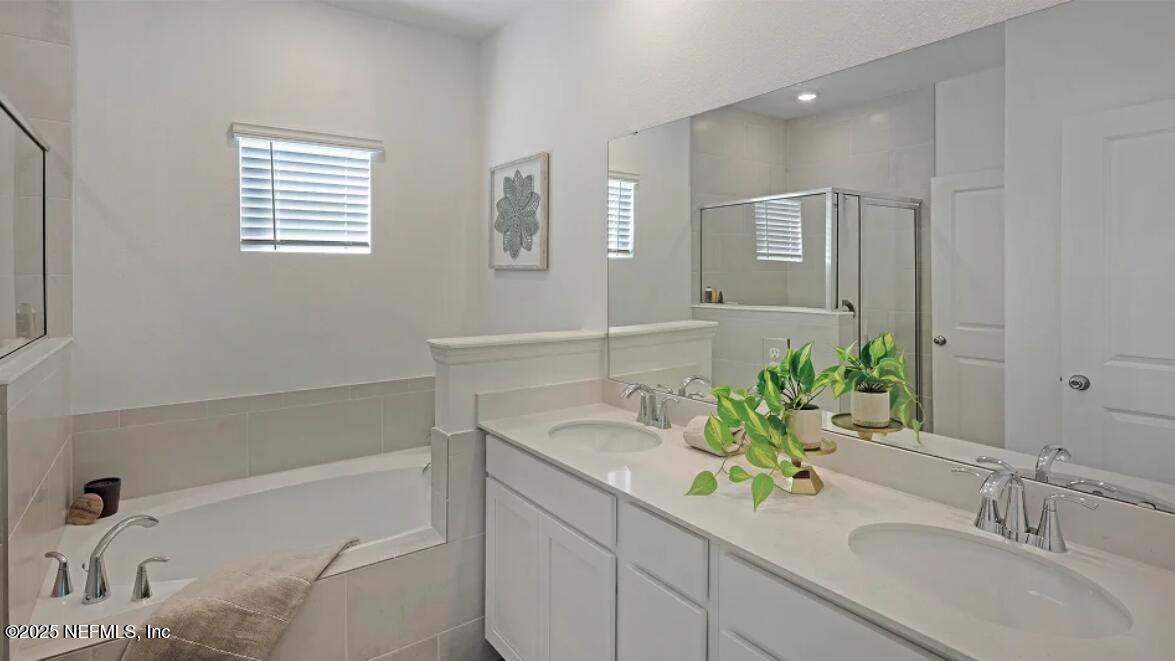 24 Bluegrass Way St. Augustine, FL 32092 - Photo 10 of 39 a bathroom with a sink and a bathtub