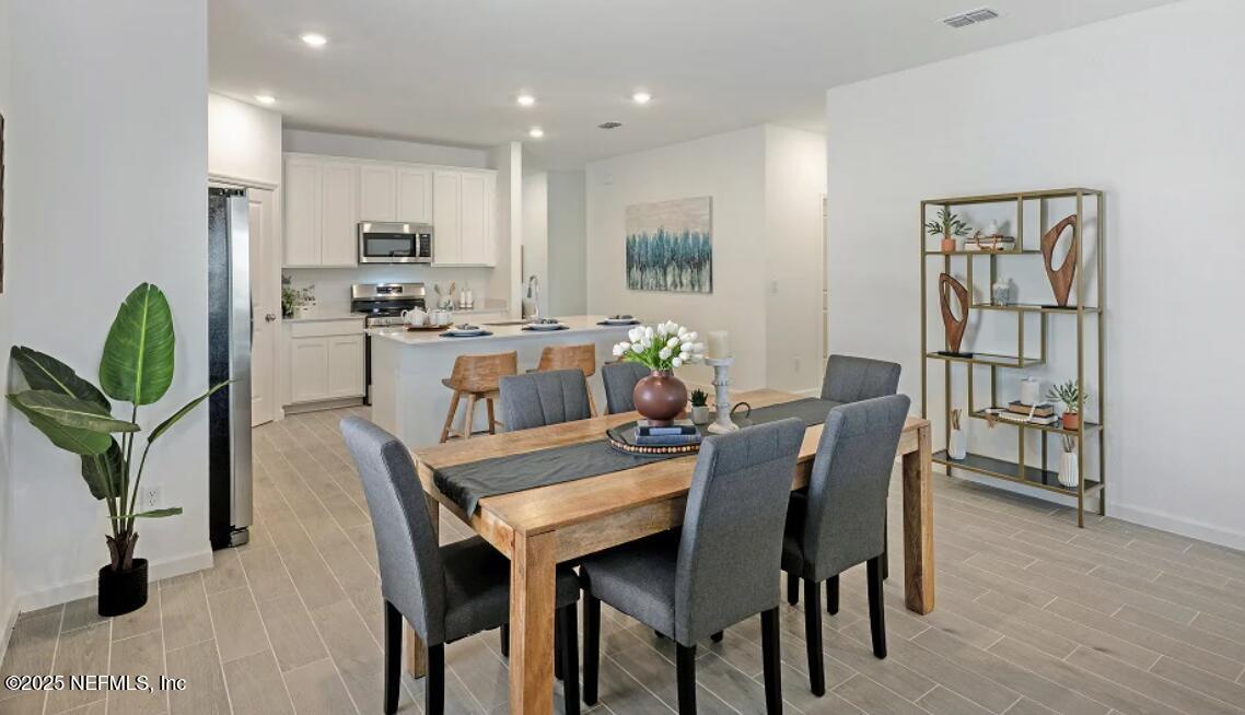24 Bluegrass Way St. Augustine, FL 32092 - Photo 11 of 39 a view of a dining room with furniture
