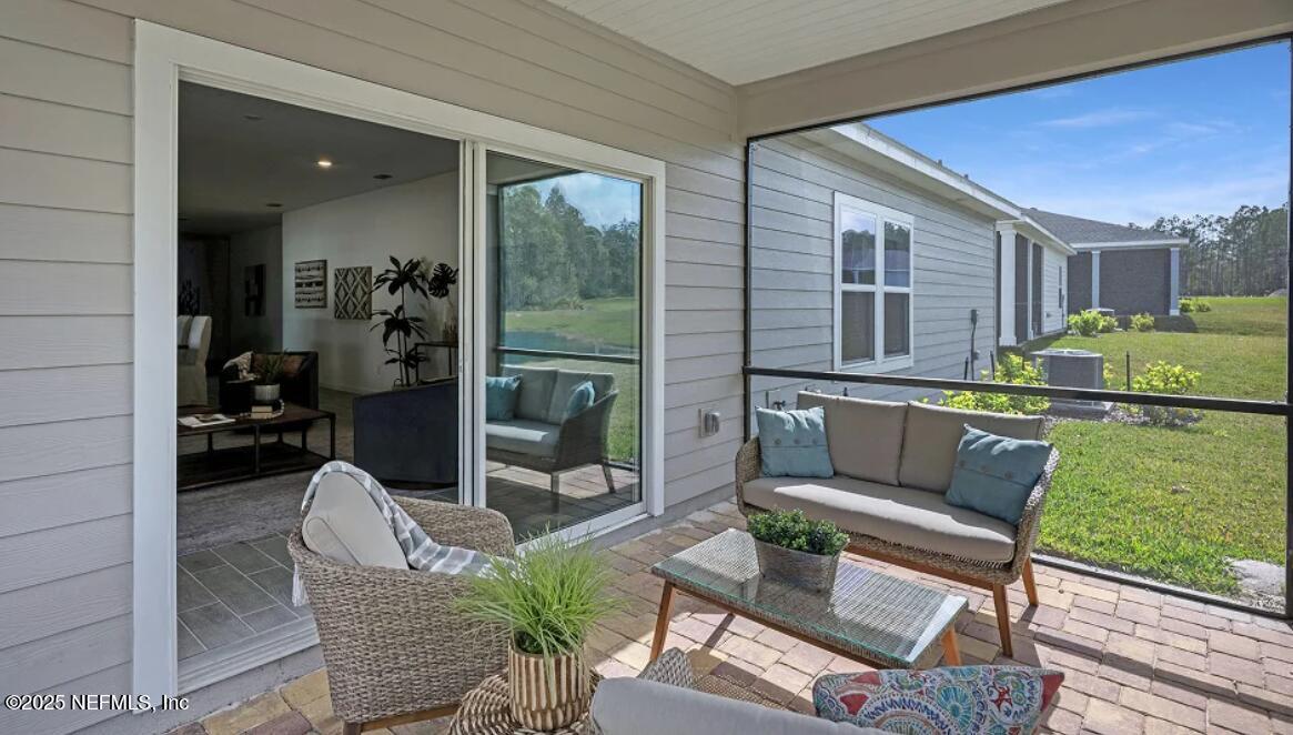 24 Bluegrass Way St. Augustine, FL 32092 - Photo 12 of 39 a outdoor living space with furniture and garden