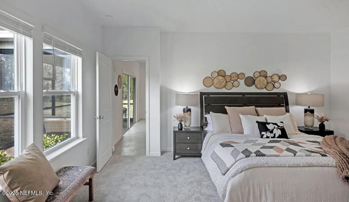 24 Bluegrass Way St. Augustine, FL 32092 - Photo 4 of 39 a bedroom with a bed and a window