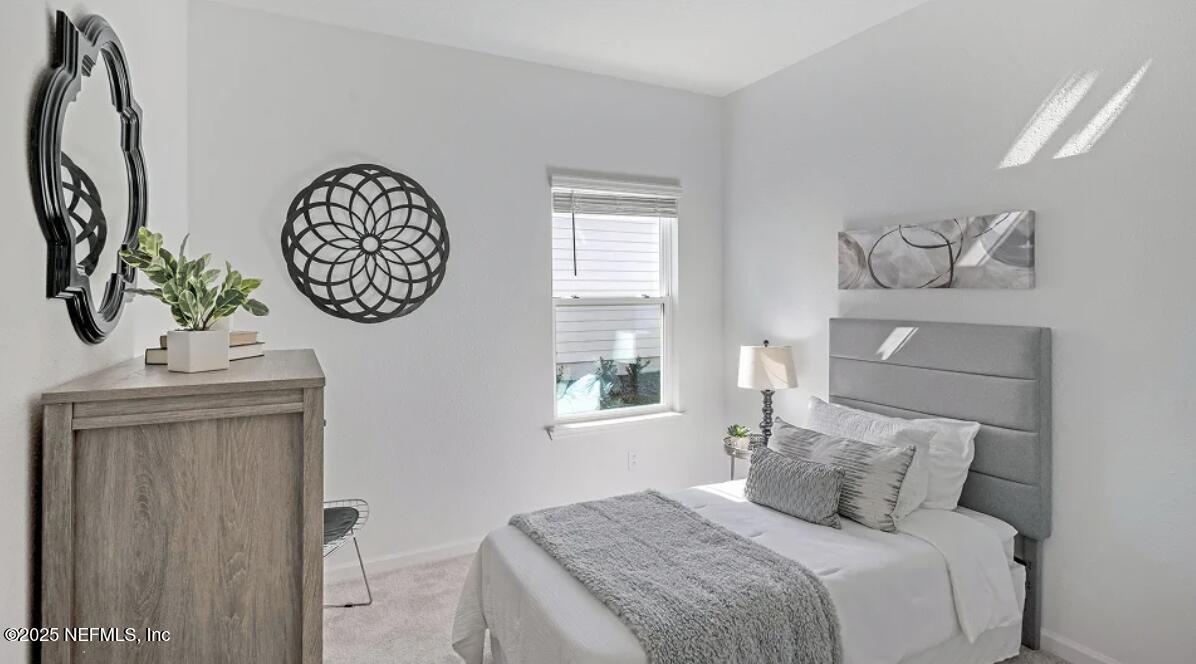 24 Bluegrass Way St. Augustine, FL 32092 - Photo 5 of 39 a bedroom with a bed and a window
