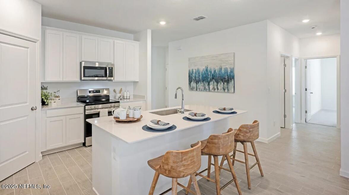 24 Bluegrass Way St. Augustine, FL 32092 - Photo 9 of 39 a view of a dining room with furniture and a kitchen
