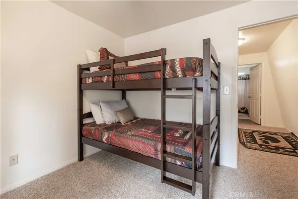 a bedroom with a bed and a closet