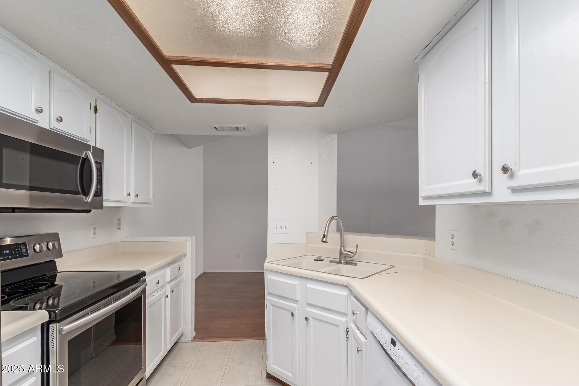 15439 North 1st Street Phoenix, AZ 85022 - Photo 12 of 26 a kitchen with a sink stove and microwave