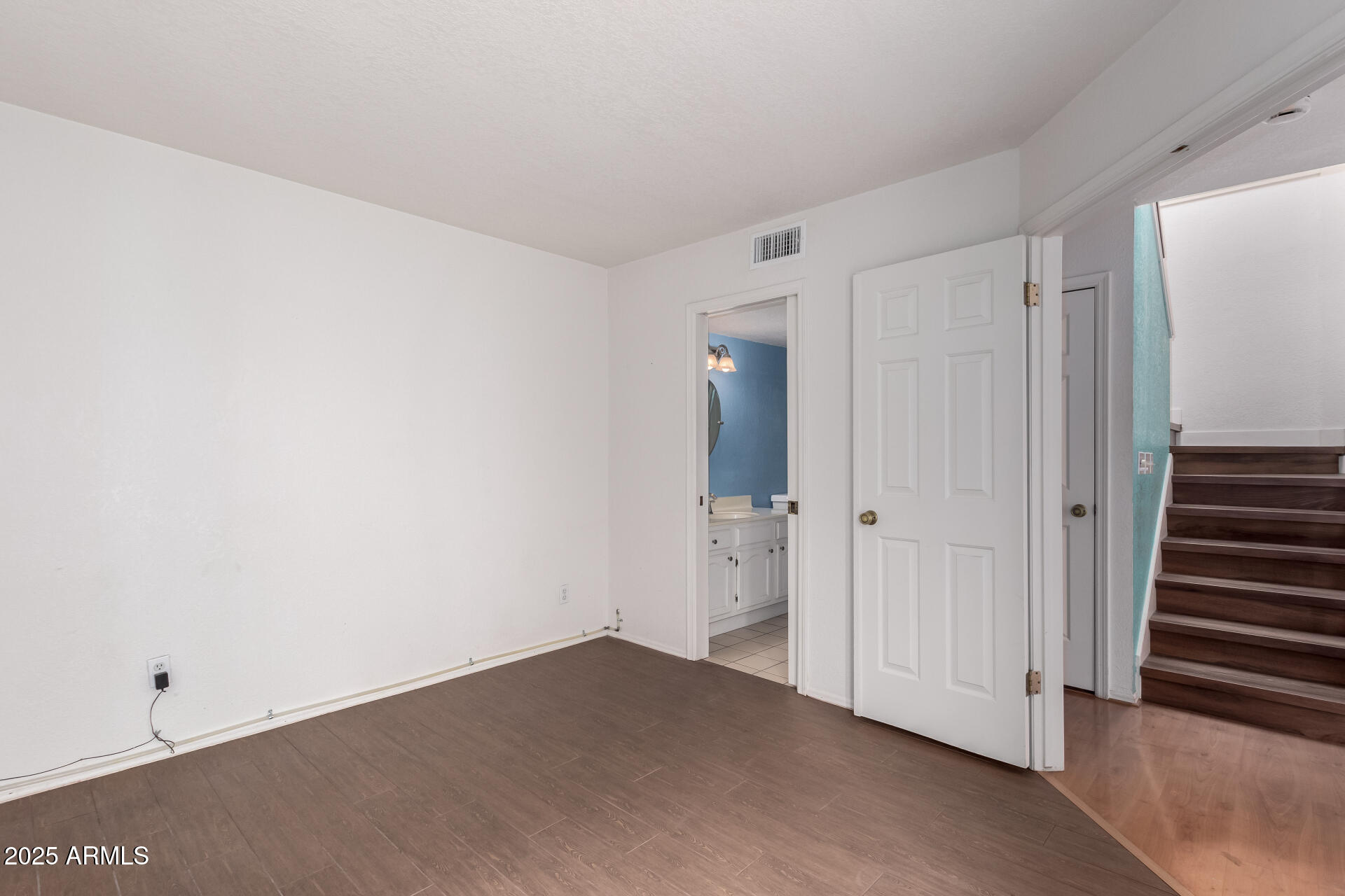 15439 North 1st Street Phoenix, AZ 85022 - Photo 15 of 26 a view of a room with wooden door