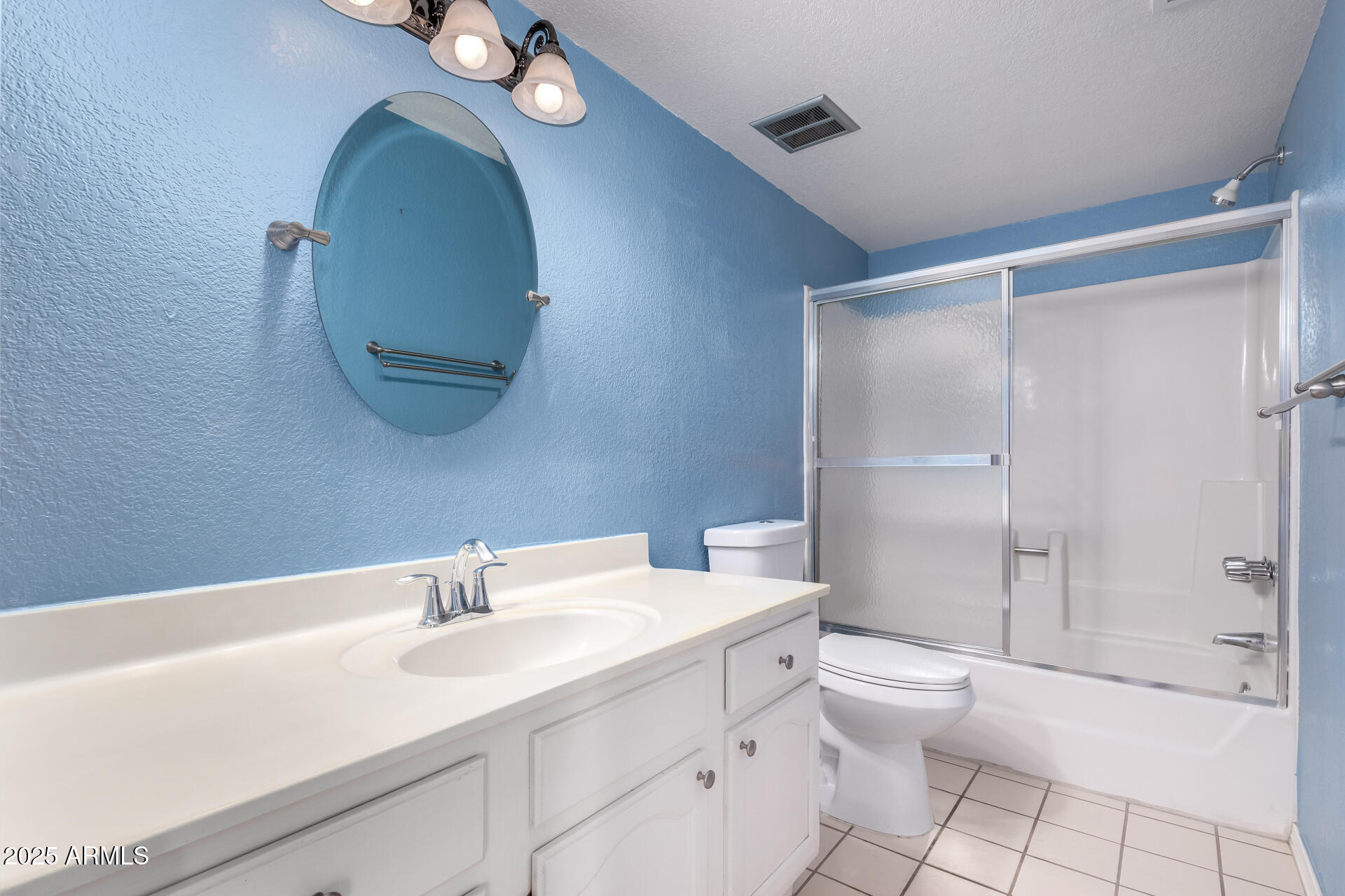 15439 North 1st Street Phoenix, AZ 85022 - Photo 16 of 26 a bathroom with a toilet a sink a glass door a shower a mirror and vanity