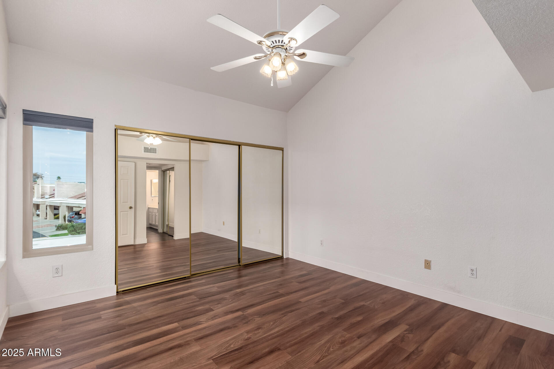 15439 North 1st Street Phoenix, AZ 85022 - Photo 20 of 26 a view of an empty room with window and wooden floor