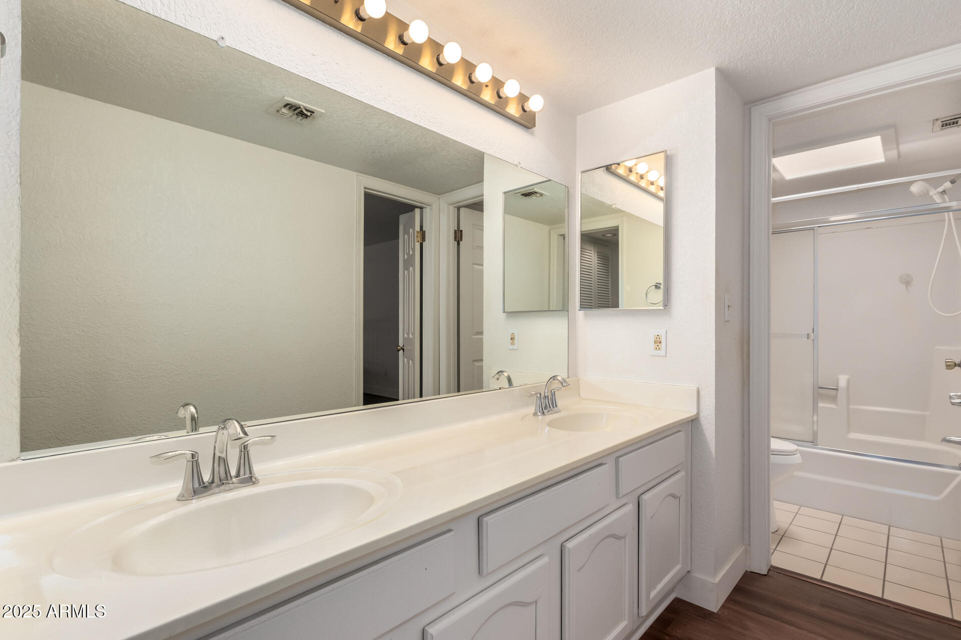 15439 North 1st Street Phoenix, AZ 85022 - Photo 23 of 26 a bathroom with a sink and a mirror