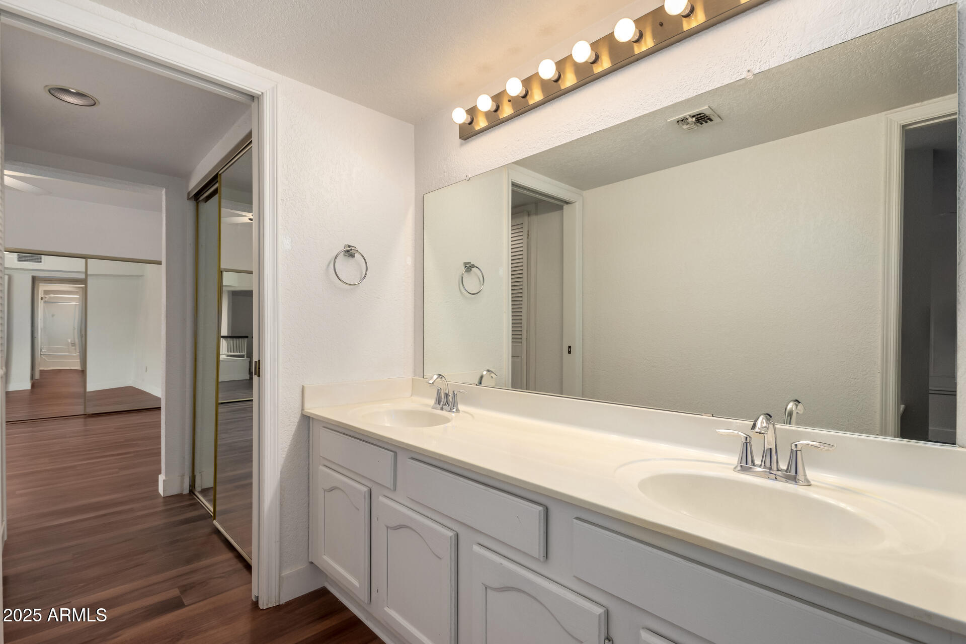 15439 North 1st Street Phoenix, AZ 85022 - Photo 24 of 26 a bathroom with a sink double vanity and a mirror