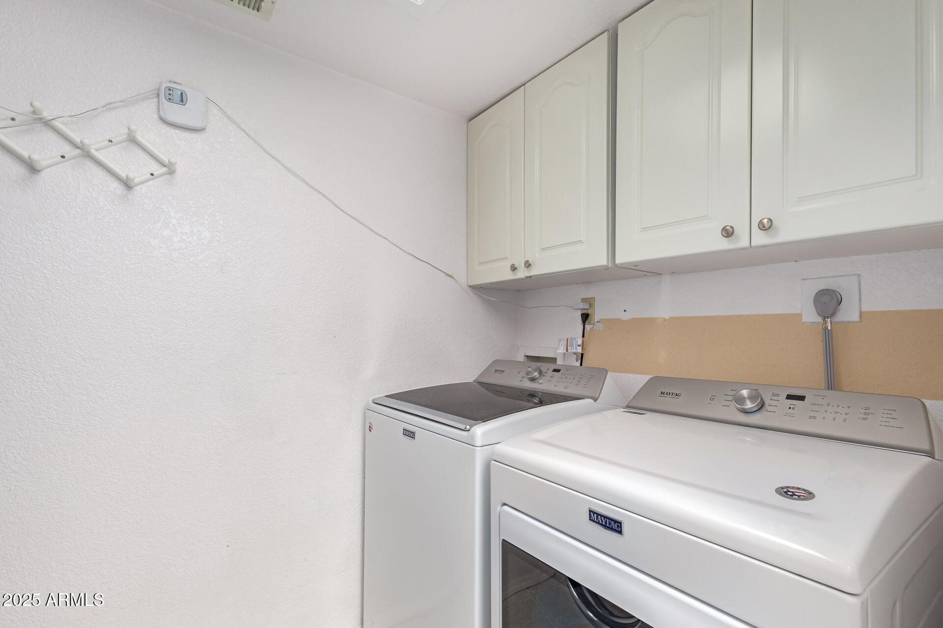 15439 North 1st Street Phoenix, AZ 85022 - Photo 25 of 26 a view of storage and utility room with washer and dryer