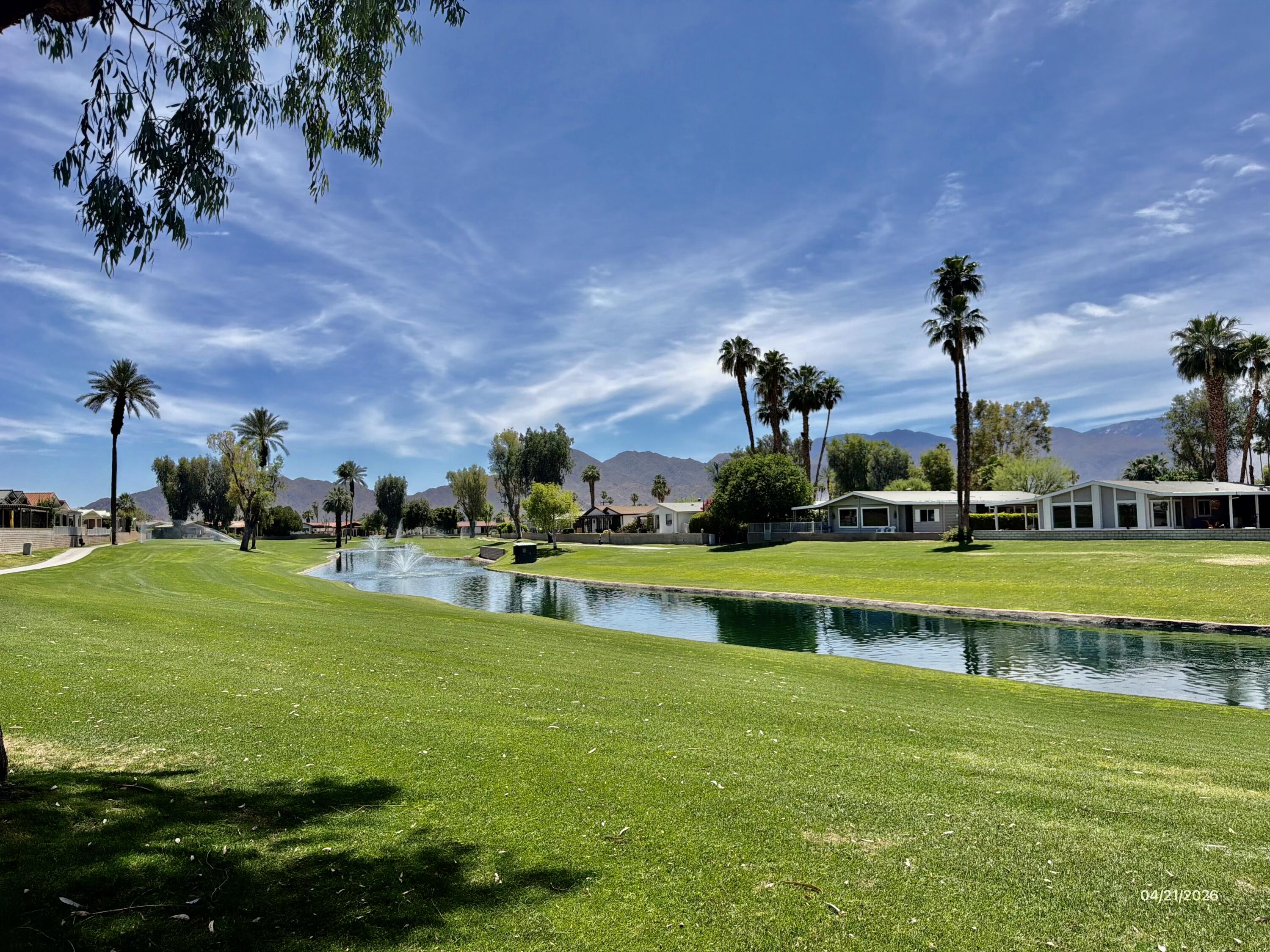 74361 Angel Camp Road Palm Desert, CA 92260 - Photo 2 of 12 a view of a house with a yard