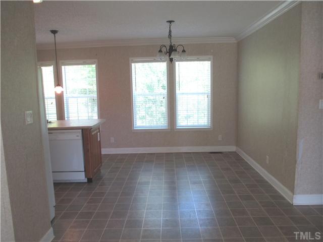 Large, airy dining area adjacent to Living Room overlooking backyard.