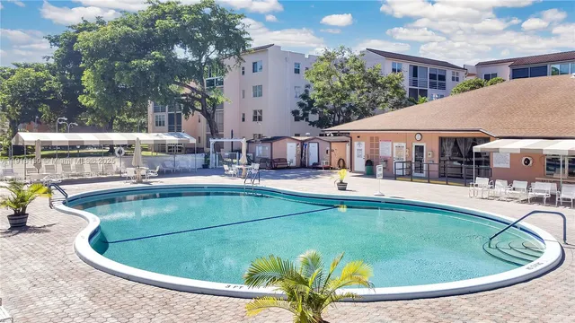 a view of a house with swimming pool