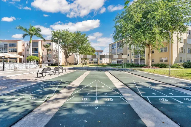 a view of a patio with a table chairs and a patio