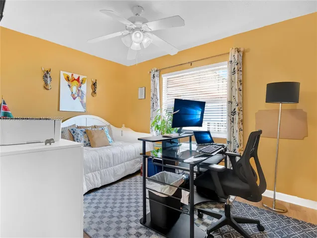 a bedroom with a bed and a table