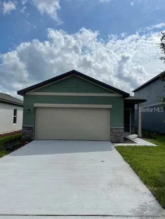 a house with yard in front of it