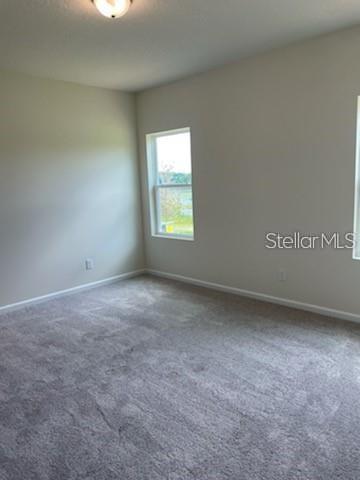 2332 Litchfield Loop DeLand, FL 32720 - Photo 8 of 15 an empty room with a window