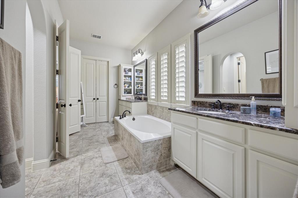580 Butchart Drive Prosper, TX 75078 - Photo 20 of 40 Full bath featuring a bath and vanity