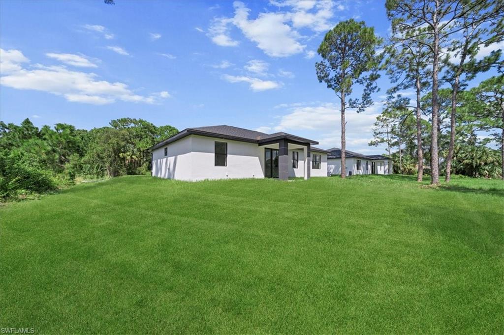 3315 67th Street West Lehigh Acres, FL 33971 - Photo 34 of 38 View of green lawn