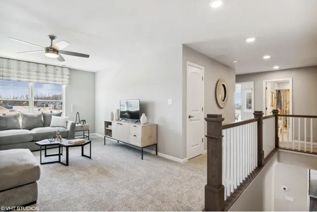 a view of living room with furniture and windows