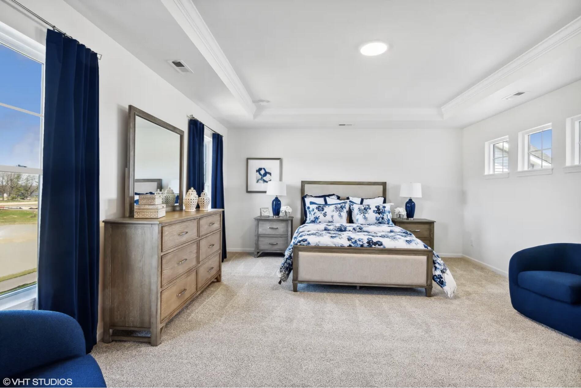 Undisclosed Address Winfield, IN 46307 - Photo 18 of 25 a spacious bedroom with a bed and a couch