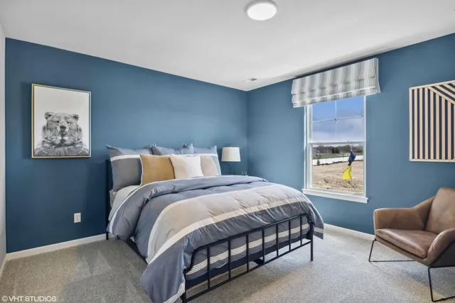 a bedroom with bed and a window