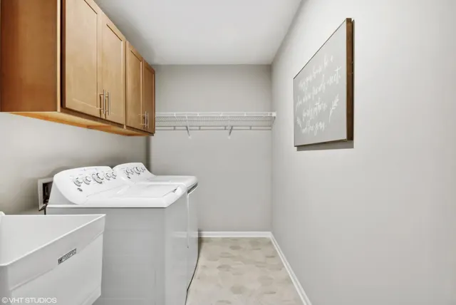 a utility room with cabinets