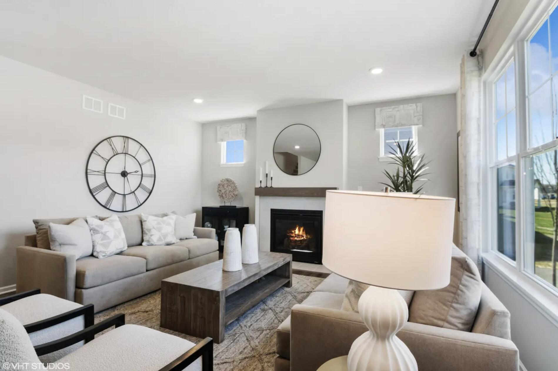 Undisclosed Address Winfield, IN 46307 - Photo 7 of 25 a living room with furniture a fireplace and a large window