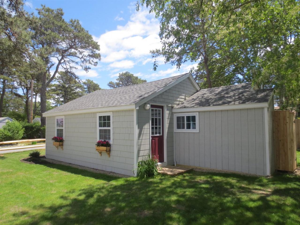 248 Old Wharf Road, Unit E2 Dennis Port, MA 02639 - Photo 21 of 27 a view of backyard of house with green space