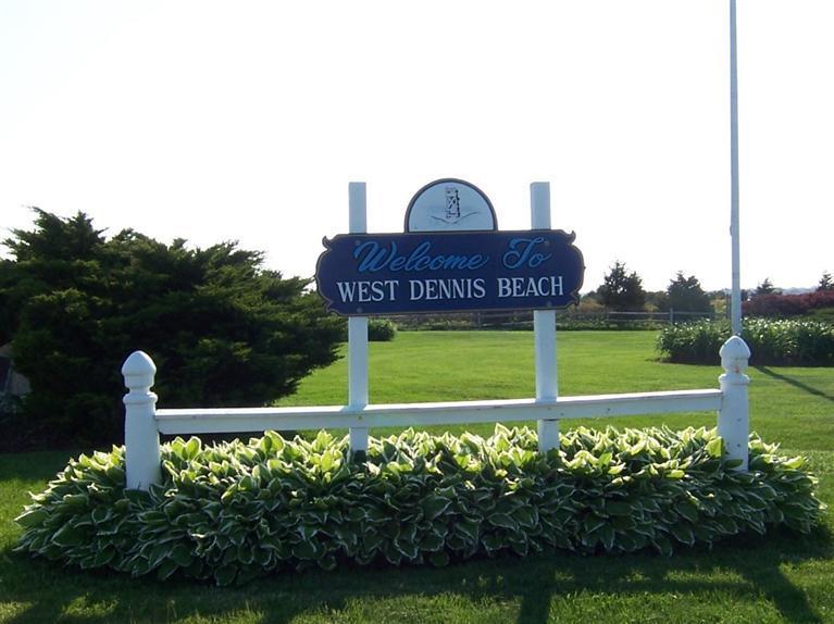 248 Old Wharf Road, Unit E2 Dennis Port, MA 02639 - Photo 27 of 27 a front view of a house with garden