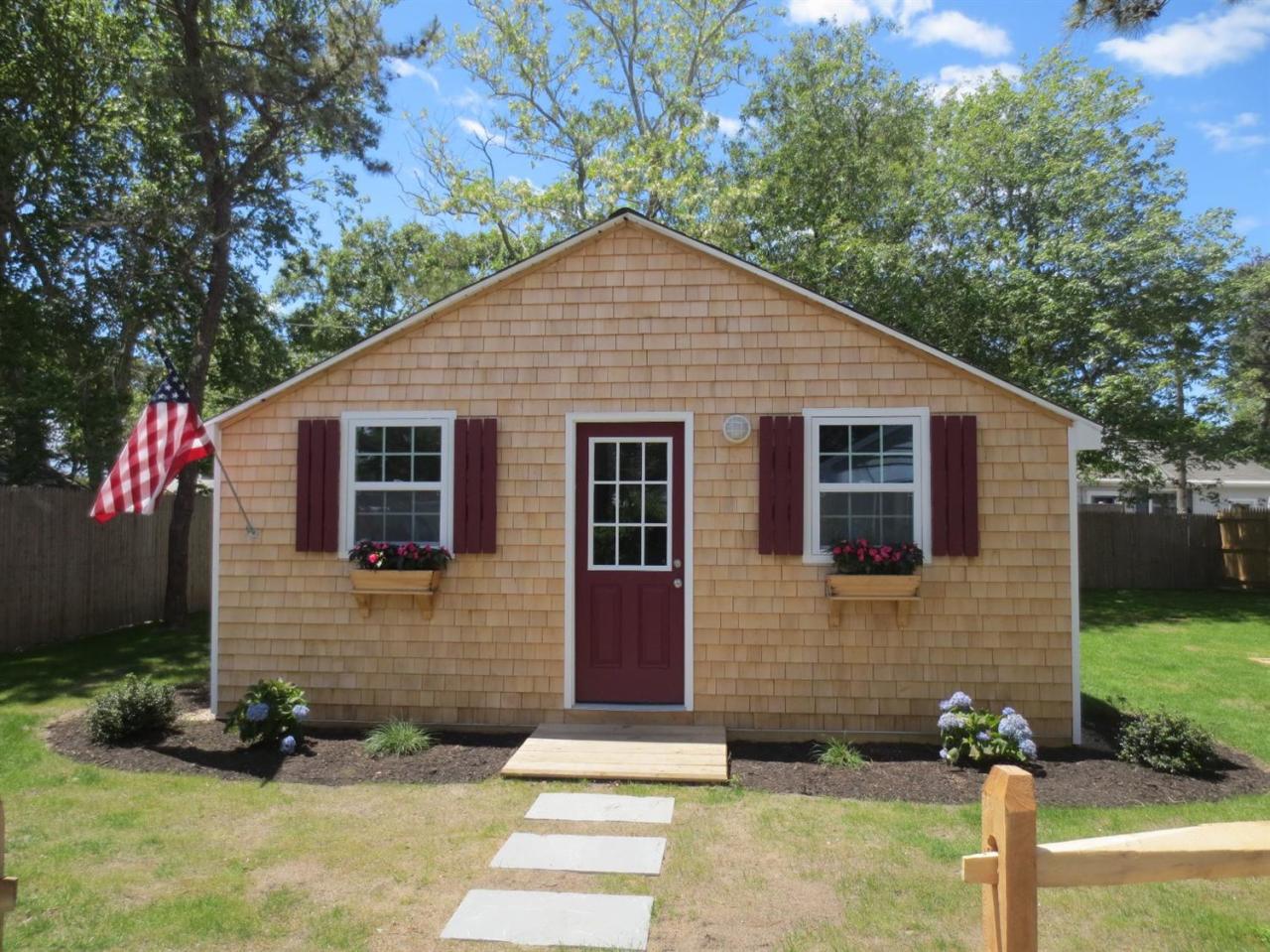 248 Old Wharf Road, Unit E2 Dennis Port, MA 02639 - Photo 8 of 27 a front view of a house with garden
