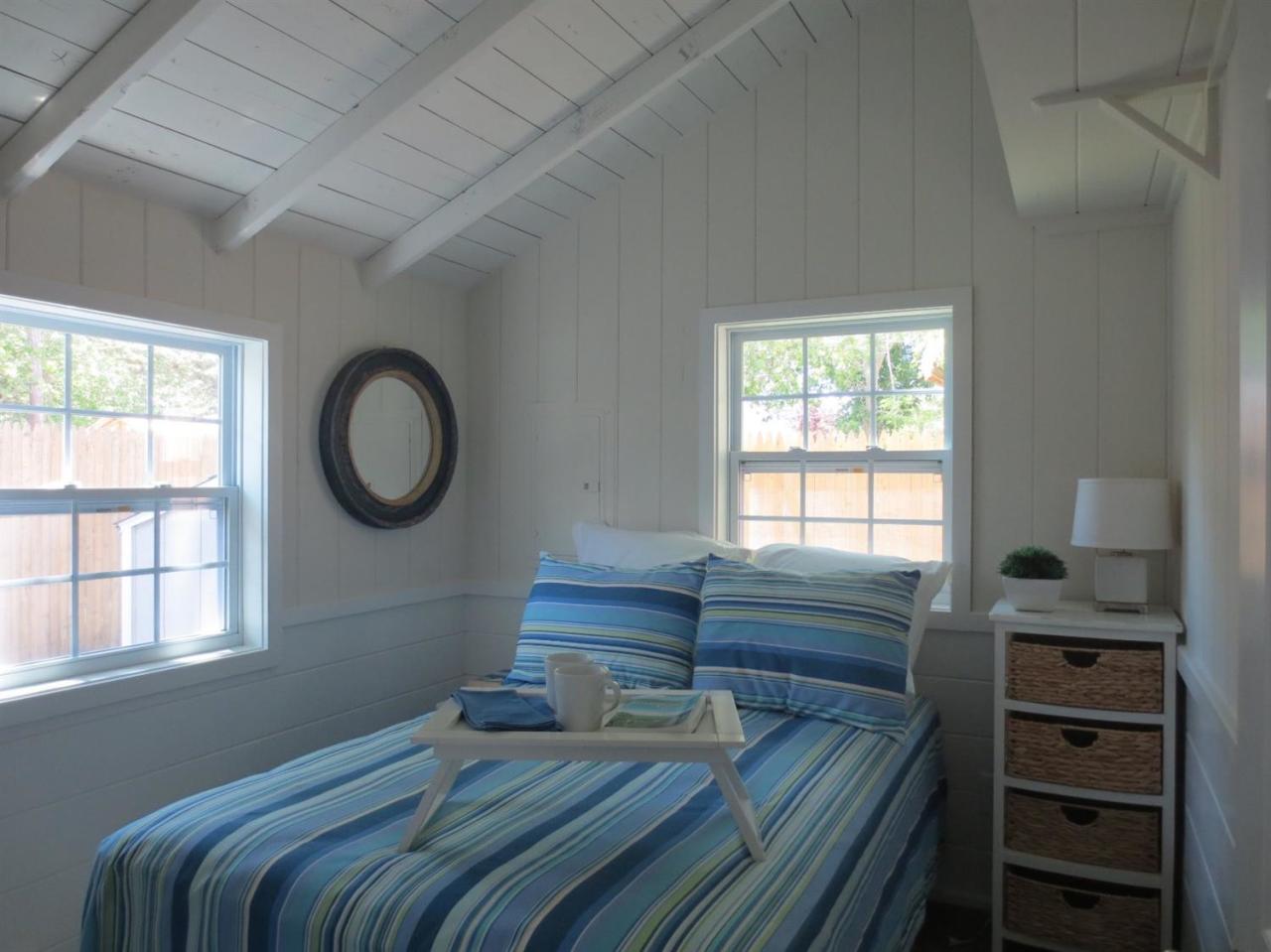 248 Old Wharf Road, Unit E2 Dennis Port, MA 02639 - Photo 9 of 27 a bedroom with a bed and a window
