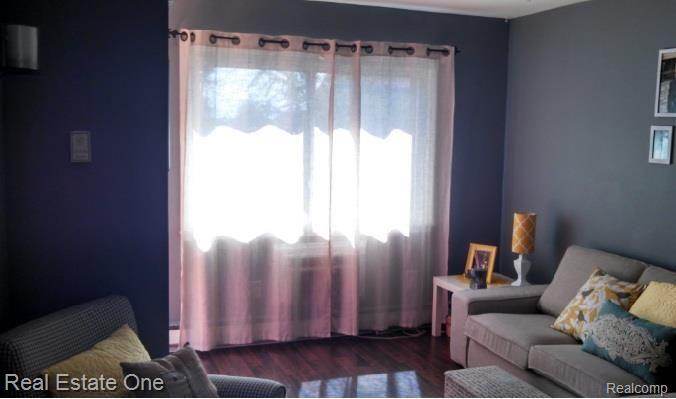 162 Ladd Road, Unit 11 Walled Lake, MI 48390 - Photo 8 of 20 living room 2.jpg