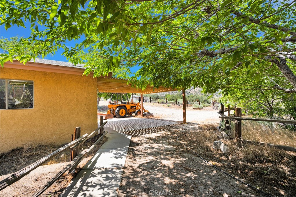 5500 Oil Well Road Phelan, CA 92371 - Photo 45 of 65 a view of a backyard with a tree