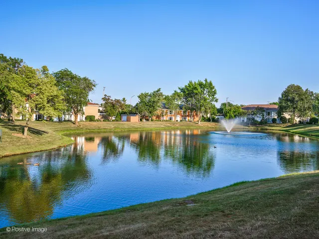 a view of a lake with houses in the background