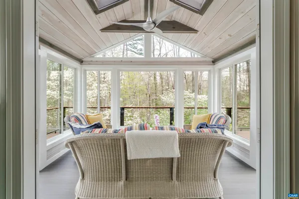 a kitchen with stainless steel appliances granite countertop a sink a stove and a wooden cabinets
